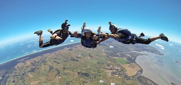 Luci doing her AFF at Sydive Auckland smiling in freefall