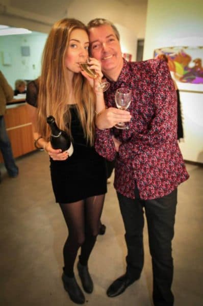 Luci and Jyro drinking glasses of wine together