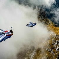 Wingsuit BASE in mountains through cloud photo by Scott Patterson edited by Chris Stewart on Icarus skydiving photography blog