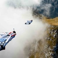 Wingsuit BASE in mountains through cloud photo by Scott Patterson edited on Icarus skydiving photography blog