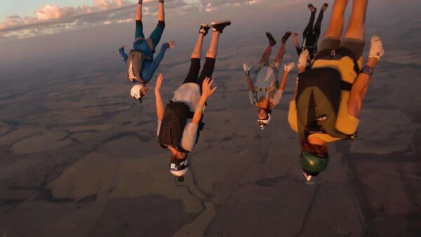 skydivers during a steep angle dive jump flying a tight formation