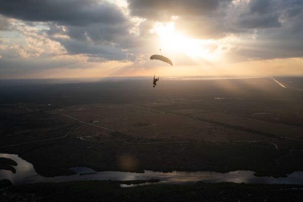 skydiver flying an NZ Aerosports Icarus Leia canopy in the sunset
