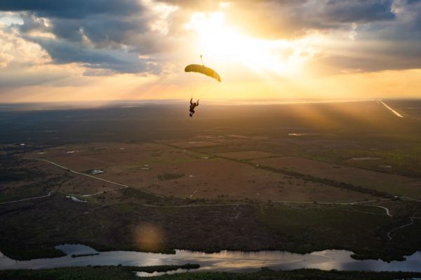 skydiver flying an NZ Aerosports Icarus Leia canopy in the sunset