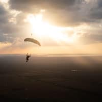 skydiver flying an NZ Aerosports Icarus Leia canopy in the sunset