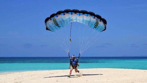 Shane Turner landing his NZ Aerosports Crossfire 3 on white sand
