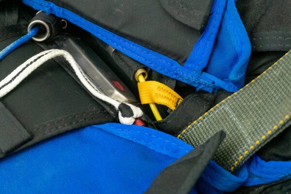 close up view of cutaway cable routed correctly through collins lanyard