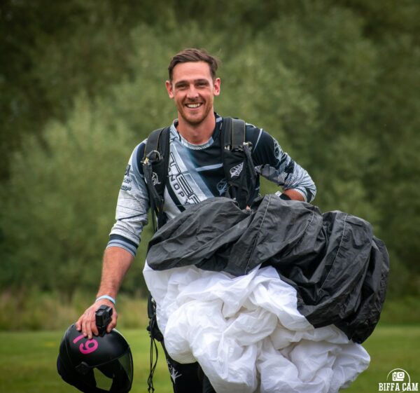 chris stewart walking with Petra in hand after landing