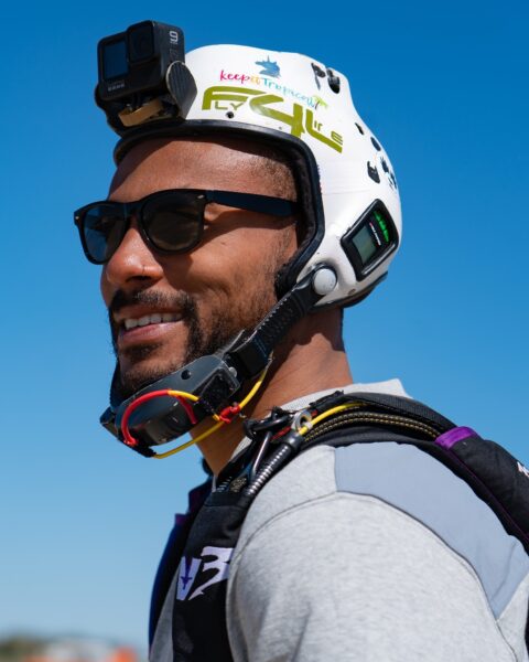 Brandon Johnson head shot smiling wearing skydive helmet