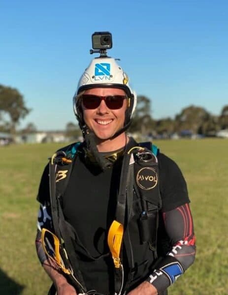 Tayne Farrant head shot facing camera smiling after landing parachute