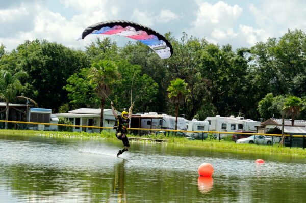 Robin Harris swooping icarus Petra over pond photo credit jim harris