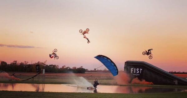 scotty hiscoe swooping icarus leia over pond with fmx riders photo credit erica tadakoro