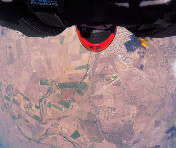 shane turner view from belly in freefall speed skydiving position with desert below