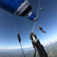 canopy pilot pov of skydiver flying leia in formation