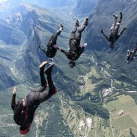 omni99 angle flying in formation with mountains in background