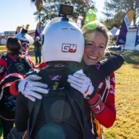 women world record project 19 karine joly hugging skydiver smiling on ground