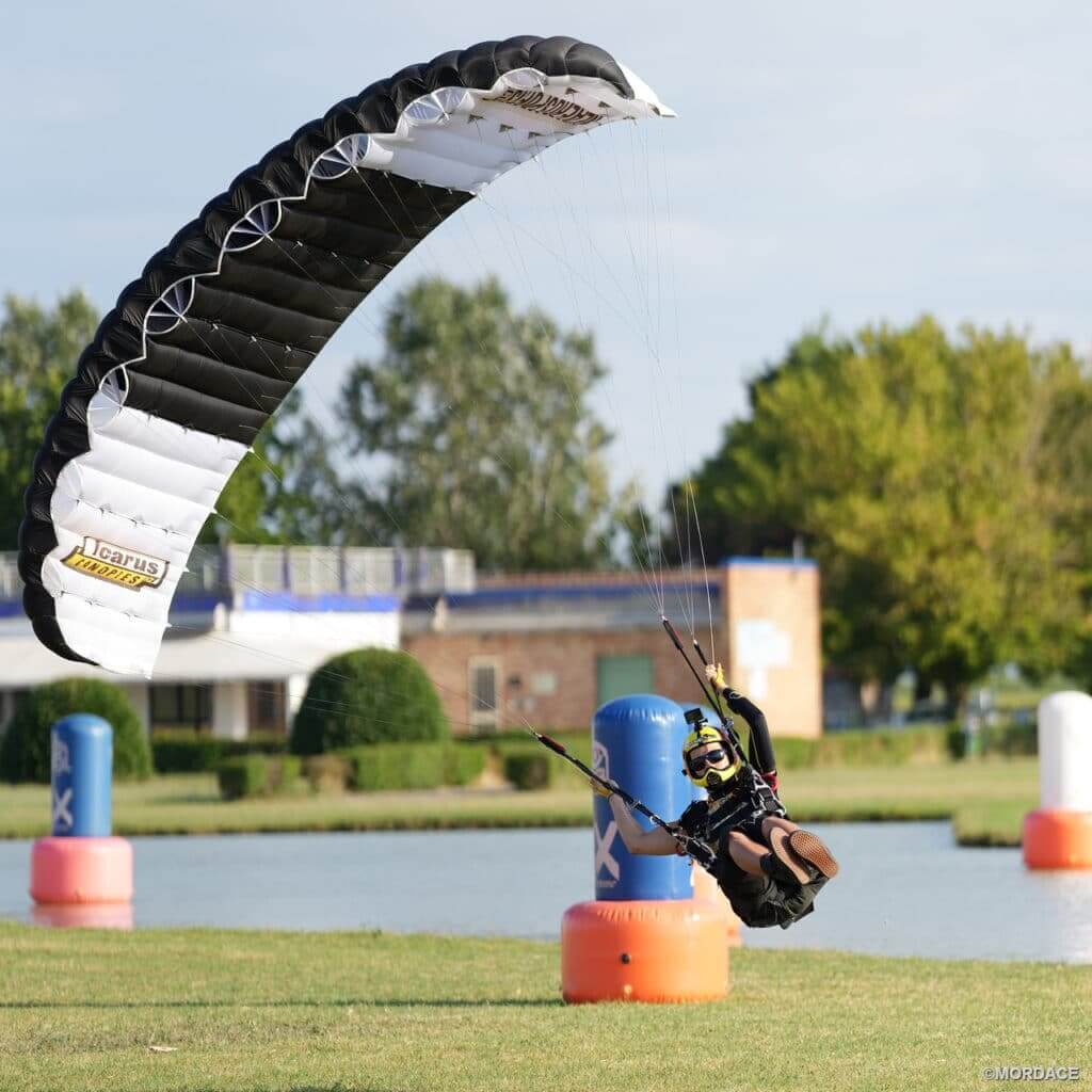 cornelia leaning back in mutant harness using rear risers to turn petra on landing