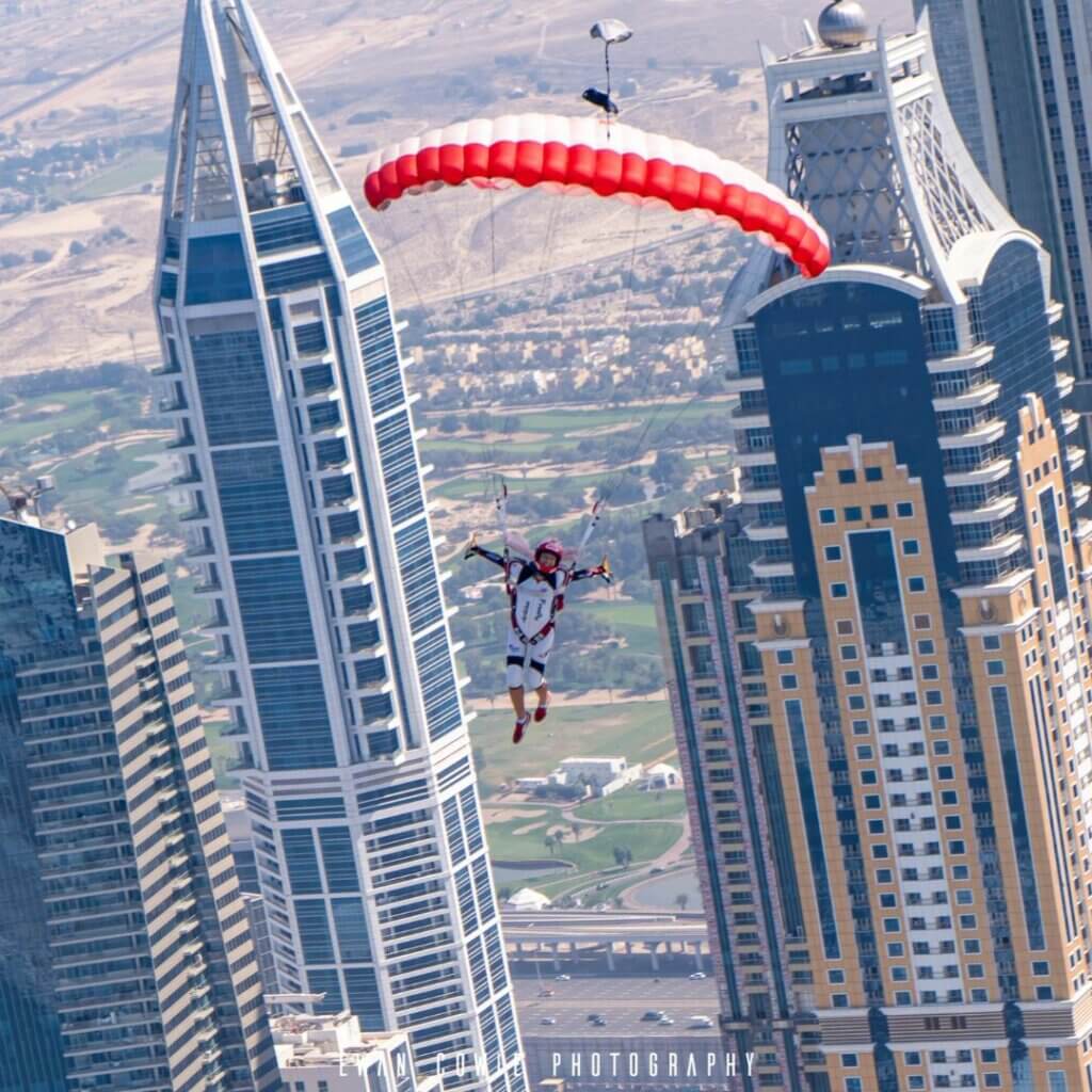 jfx 2 flying in front of skyscrapers