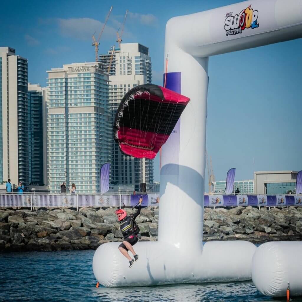 olga flying through gates at swoop festival