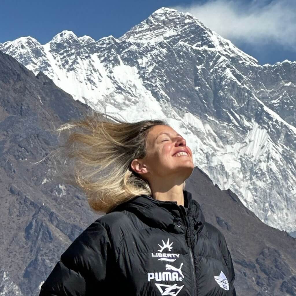 karine joly standing in front of mount everest