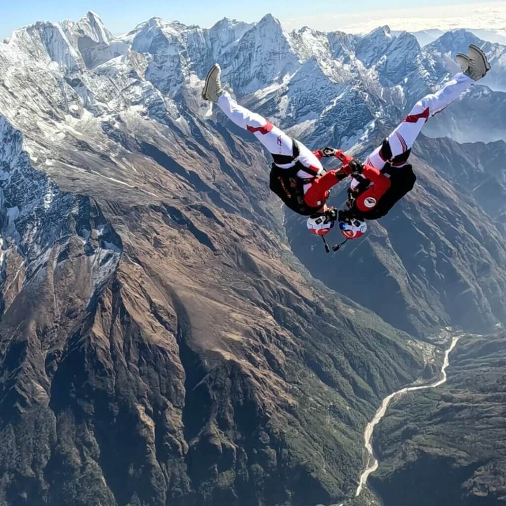 greg and karine flying together in freefall in front of everest